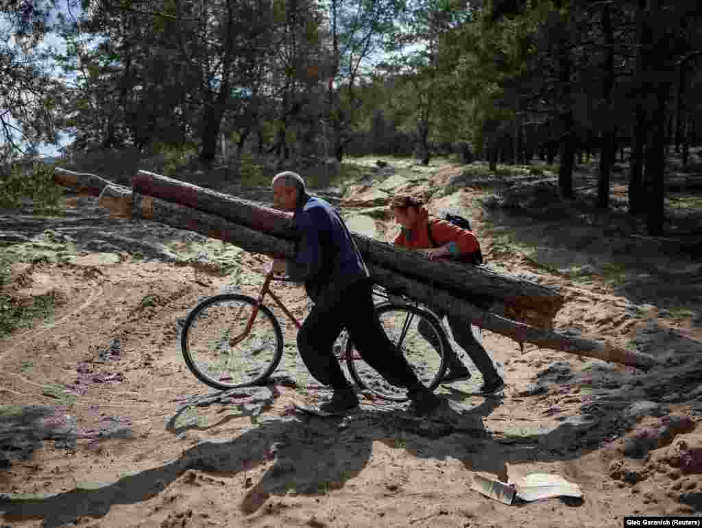 Local residents collect firewood from abandoned positions of the Russian military in Izyum, Ukraine, on September 25.&nbsp; Up until recently, air quality across Europe had been steadily improving. The extraordinary circumstances of the winter of 2022 however, are likely to see that trend reverse, at least in the short term.&nbsp;&nbsp; &nbsp;
