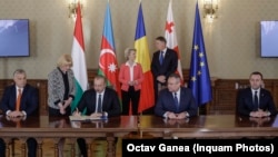 (Left to right) Hungarian Prime Minister Viktor Orban, Azerbaijani President Ilham Aliyev, Romanian President Klaus Iohannis, and Georgian Irakli Garibashvili at the signing ceremony in Bucharest on December 17.