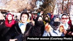 Afghan women and girls protest in Kabul on December 22 against a Taliban ban on female students in universities. 