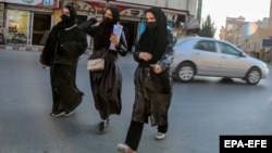 Afghan female students leave Kabul University on December 21.