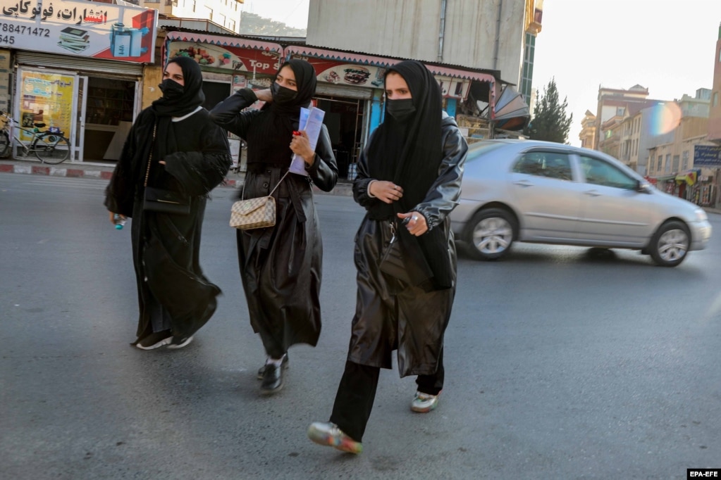 Female students leave Kabul University on December 21, 2022, after the Taliban banned them from attending universities.