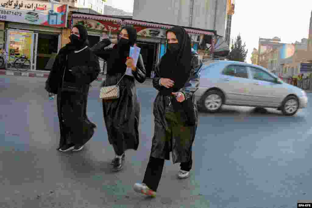 Afghan female students leave Kabul University on December 21.