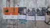 Политический словарь в плакатах от «Радио Свобода» и «Настоящего Времени» на заборе на улице Николая Бараташвили в Батуми