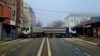 Trucks block a road in the northern city of Mitrovica on December 27. 