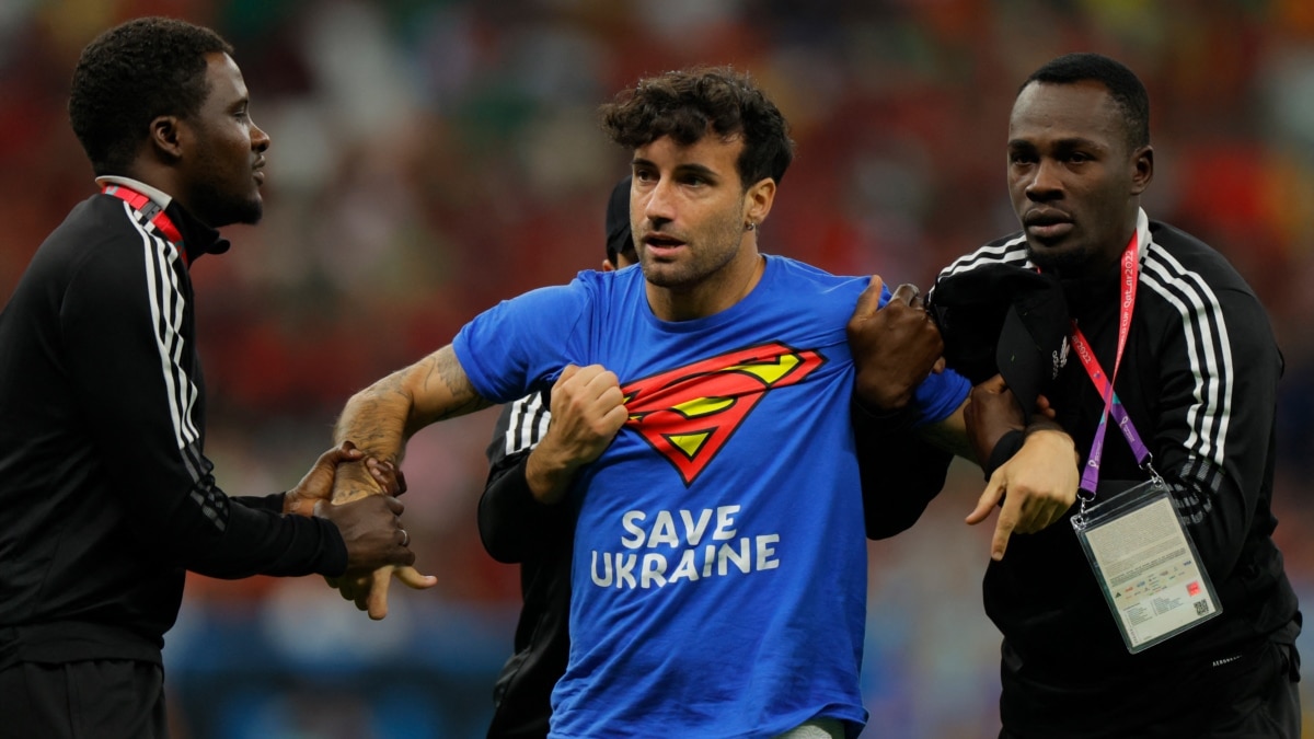 Protester with rainbow flag runs onto field at World Cup