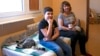 Nazar Ismailov with his mother, Olha, in their apartment in the Czech town of Usti nad Labem, where they have settled since fleeing Kharkiv after Russia invaded Ukraine. 