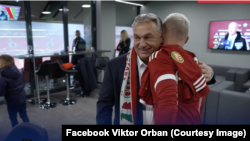 Hungarian Prime Minister Viktor Orban wears a scarf around his neck with a map of Greater Hungary at a soccer match on November 20.