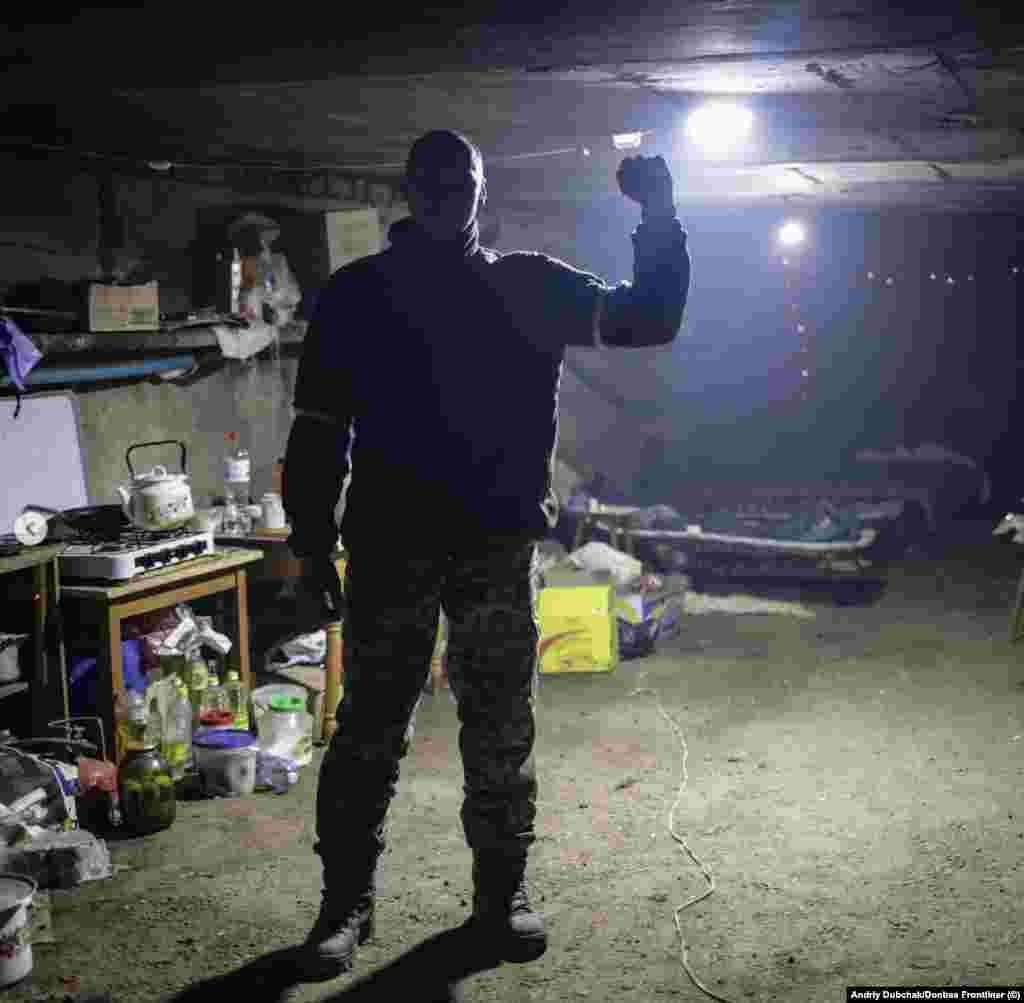 A Ukrainian soldier gestures in an underground military base. Ukrainian fighters told Dubchak that the fighting has become somewhat easier than in the early weeks of the 2022 invasion thanks to the supply of largely Western weapons, and the battle experience that Kyiv&#39;s forces have now attained.&nbsp; Still, Dubchak says of the freezing, beleaguered city, &quot;Bakhmut is a nightmare.&quot;&nbsp;