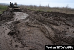A Ukrainian tank moves through a muddy field near an undisclosed frontline position in eastern Ukraine on November 28.