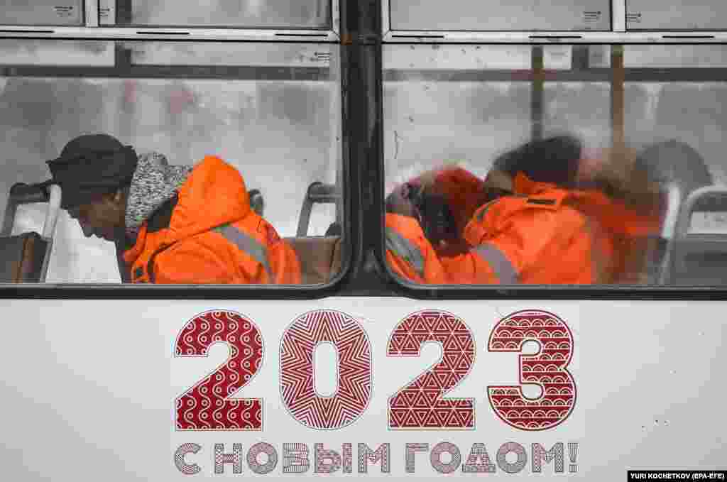 Municipal workers sleep on a bus in downtown Moscow as temperatures dropped to minus 15 degrees Celsius on January 11.