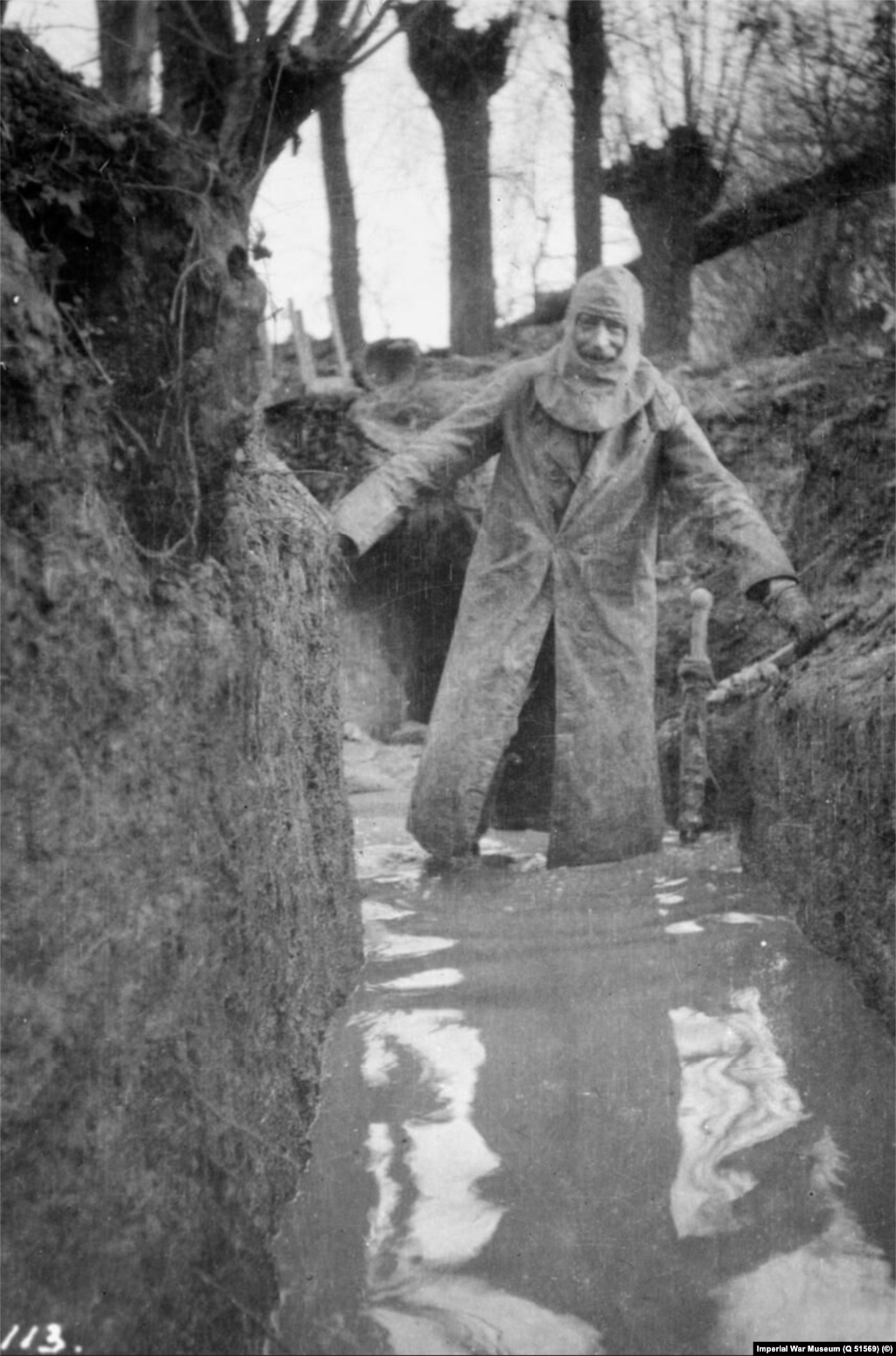 A British officer wades through a trench in&nbsp;Bois Grenier, in northern France, in January 1915.&nbsp;