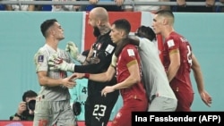 Swiss captain Granit Xhaka (left) scuffles with Serbian players during their World Cup group game in Doha on December 2. 