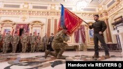 Ukrainian President Volodymyr Zelenskiy attends an award ceremony of a battle banner to an army brigade on the Day of the Ukrainian Armed Forces in Kyiv on December 6.