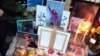 Mourners laid photos and other tributes on December 21 on the grave of Ghazale Chalabi, who was shot in the head by security forces during a protest on September 27 in Amol, Iran.