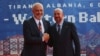 Albanian Prime Minister Edi Rama (left) welcomes European Council President Charles Michel before the EU-Western Balkans summit in Tirana on December 6.