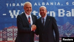 Albanian Prime Minister Edi Rama (left) welcomes European Council President Charles Michel before the EU-Western Balkans summit in Tirana on December 6.
