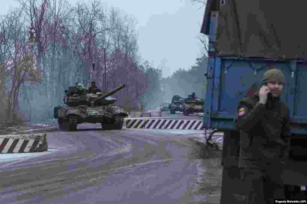 Ukrainian tanks roll toward the front line in the Donetsk region. Ukrainian troops are defending Bakhmut&#39;s northern, eastern, and southern approaches against Russian forces, who are launching ferocious attacks to seize territory that some analysts say is of no strategic military value.