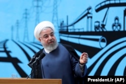 Iranian President Hassan Rohani speaks at a conference in Tehran on August 26.