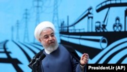 Iranian President Hassan Rohani speaks at a conference in Tehran, August 26, 2019