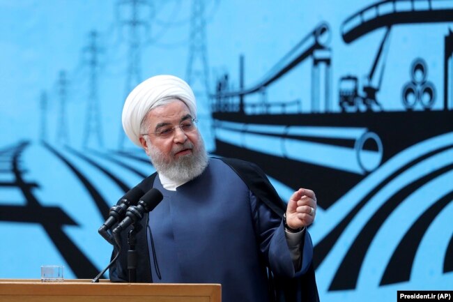 Iranian President Hassan Rohani speaks at a conference in Tehran on August 26.