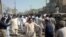 Local Pakistani residents gather at the site of a bomb blast in Sibi, some 180 kilometres southeast of Quetta. At least 10 people died in the explosion.