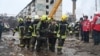 Rescue workers remove the body of a civilian following a missile strike on the central Ukrainian city of Poltava on February 1. 