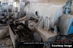 Машина для производства оливкового масла в цехе завода, разрушнного, предположительно, в результате бомбардировок российской авиации 13 ноября