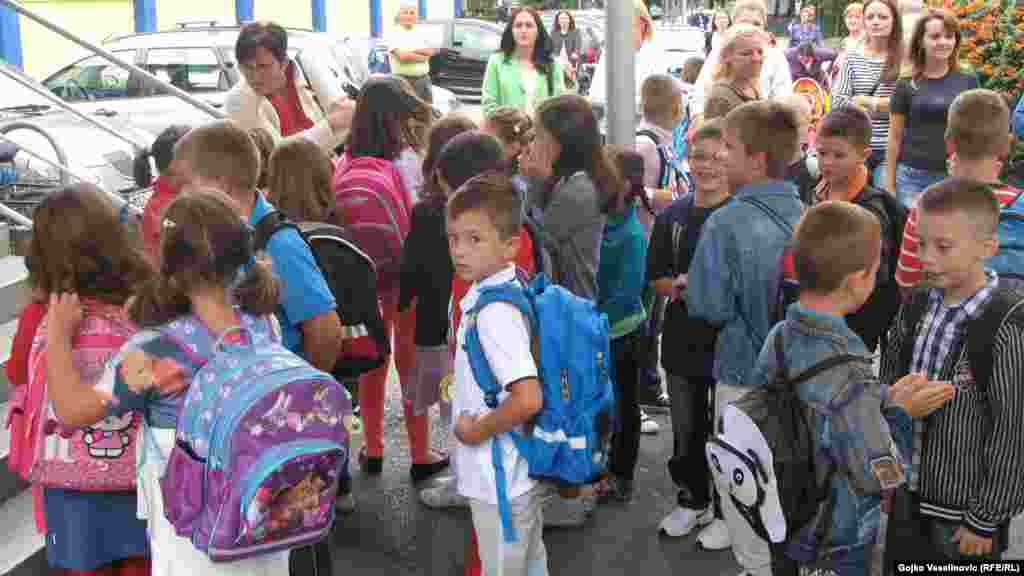 A more casually dressed crowd gathers at an elementary school in Banja Luka, Bosnia-Herzegovina.