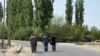 Soldiers walk through the village of Dostuk in Kyrgyzstan's Batken region on April 13. 