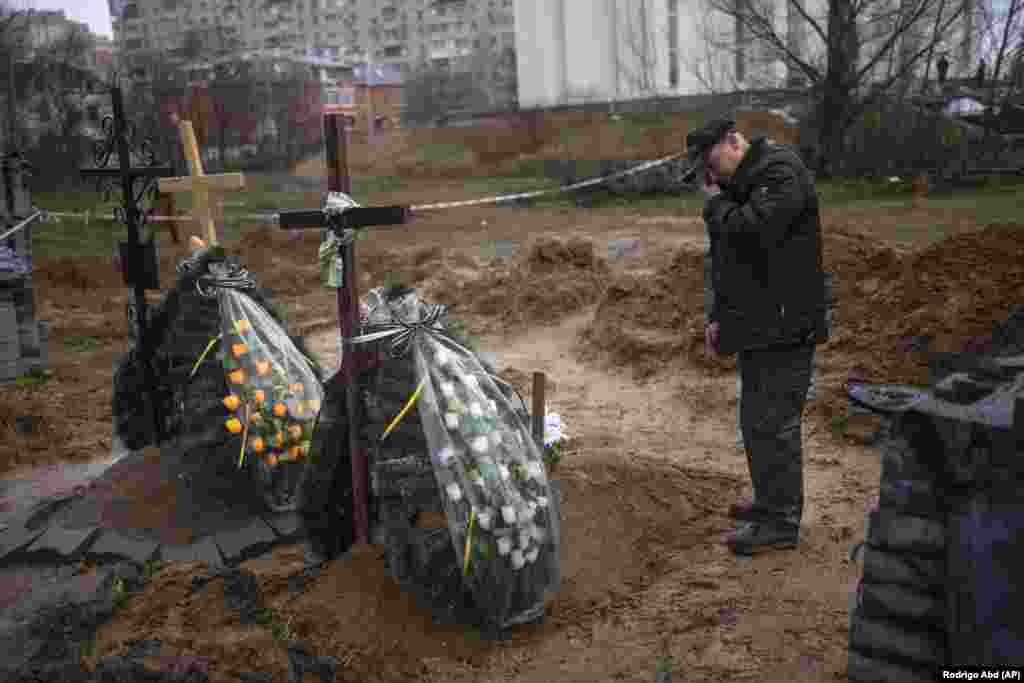 A man in Bucha, Ukraine, mourns for his mother, who was killed during the occupation of the town by Russian forces.&nbsp;