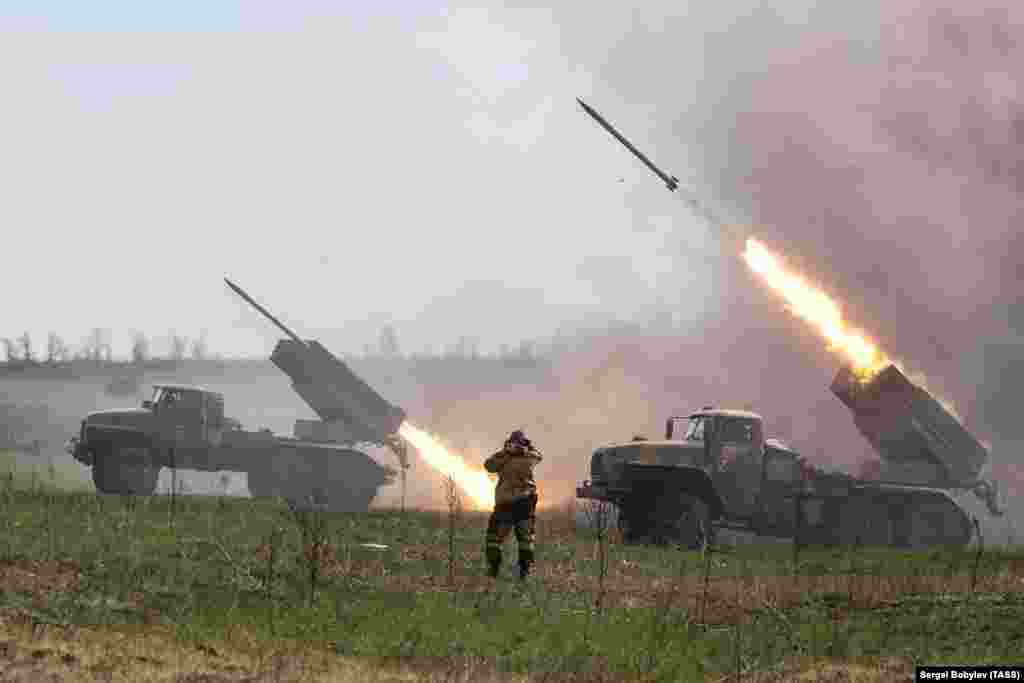 Moscow-backed separatist fighters fire a volley of Grad rockets at Ukrainian forces in the Donetsk region on April 11.&nbsp;