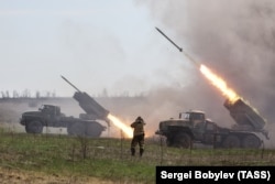 Moscow-backed separatist fighters fire a volley of Grad rockets at Ukrainian forces in the Donetsk region on April 11.