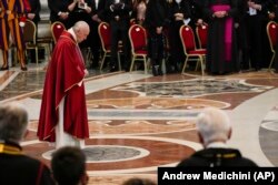 Pope Francis arrives to celebrate a Good Friday Mass at the Vatican.