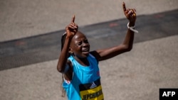 Peres Jepchirchir of Kenyan crosses the finish line after taking first in the womens division in the 126th Boston Marathon on April 18.