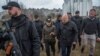 International Criminal Court prosecutor Karim Khan (2nd right) and Ukrainian Prosecutor-General Iryna Venediktova visit the site of a mass grave in the town of Bucha, outside Kyiv, on April 13.