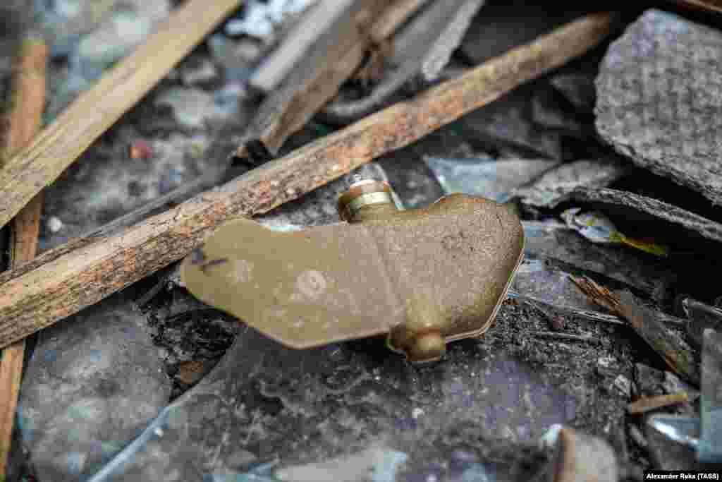 A PFM-1 &quot;butterfly mine&quot; is seen in Popasnaya on April 11. The cellphone-sized mines are designed to be dropped from aircraft and spin slowly to the ground. Around 5 kilograms of pressure is sufficient to detonate the camouflaged anti-personnel mines.&nbsp;