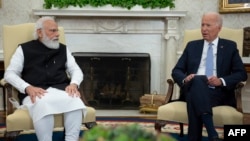 US President Joe Biden (left) had an hourlong video call with Indian Prime Minister Narendra Modi on April 11. (file photo)