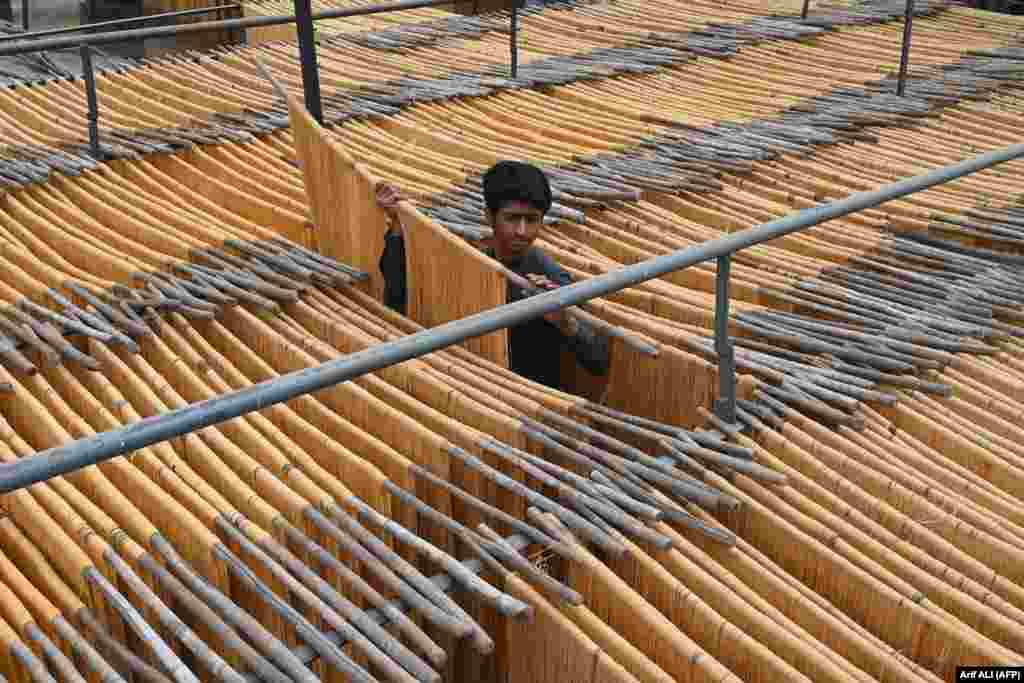 A worker dries vermicelli used to make a traditional sweet dish that is popular during the fasting month of Ramadan, in Lahore, Pakistan.&nbsp;