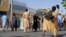 Afghan protesters pelted the Iranian Consulate in Herat with stones on April 11 and appeared to set fire to part of it. 