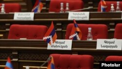 Armenia - Karabakh flags on the empty seats of opposition members of the Armenian parliament, April 12, 2022.