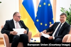 Двостороння зустріч віцепрем'єра України з євроінтеграції Тараса Качки та єврокомісара з питань економіки Валдіса Домбровскіса на полях міжурядової конференції Україна-ЄС. Брюссель, Бельгія, 14 липня 2026 року