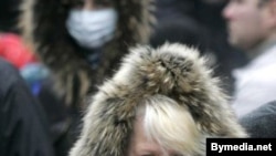 People wear protective masks in the Belarusian capital, Minsk, on November 4.