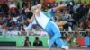 Wrestler Ikhtiyor Navruzov of Uzbekistan celebrates with his coach after winning a bronze medal.