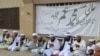 Pakistani supporters of Afghan Taliban leader Mullah Mohammad Omar at a ceremony in the southwestern Pakistani city of Quetta in July.