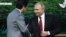 Japanese Prime Minister Shinzo Abe (left) shakes hands with Russian President Vladimir Putin during a session of the Eastern Economic Forum in Vladivostok on September 12.