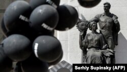 Demonstrators set black balloons at the Ukrainian parliament entrance to protest against a banking reform during an extraordinary session in Kyiv on May 13.