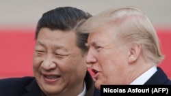 Chinese President Xi Jinping (left) and U.S. President Donald Trump in Beijing on November 9