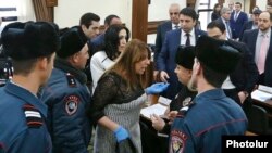 Armenia - Yerkir Tsirani party leader Zaruhi Postanjian argues with police officers moments after a violent incident at Yerevan's municipal council, 13 Februay 2018.