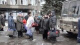 Ukrainian Civilians Flee Battle-Scarred Town
