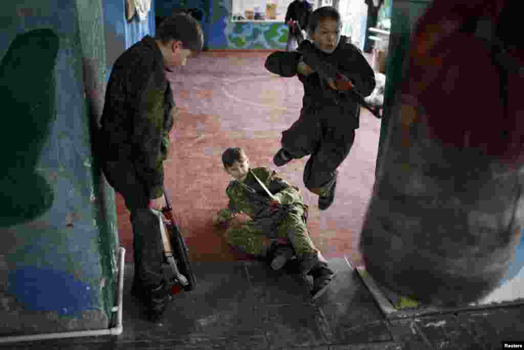 Boys take part in military training at a boot camp at the Russkiye Vityazi (Russian Knights) military patriotic club in the village of Sengileyevskoye, outside Stavropol, Russia. (Reuters/Eduard Korniyenko)